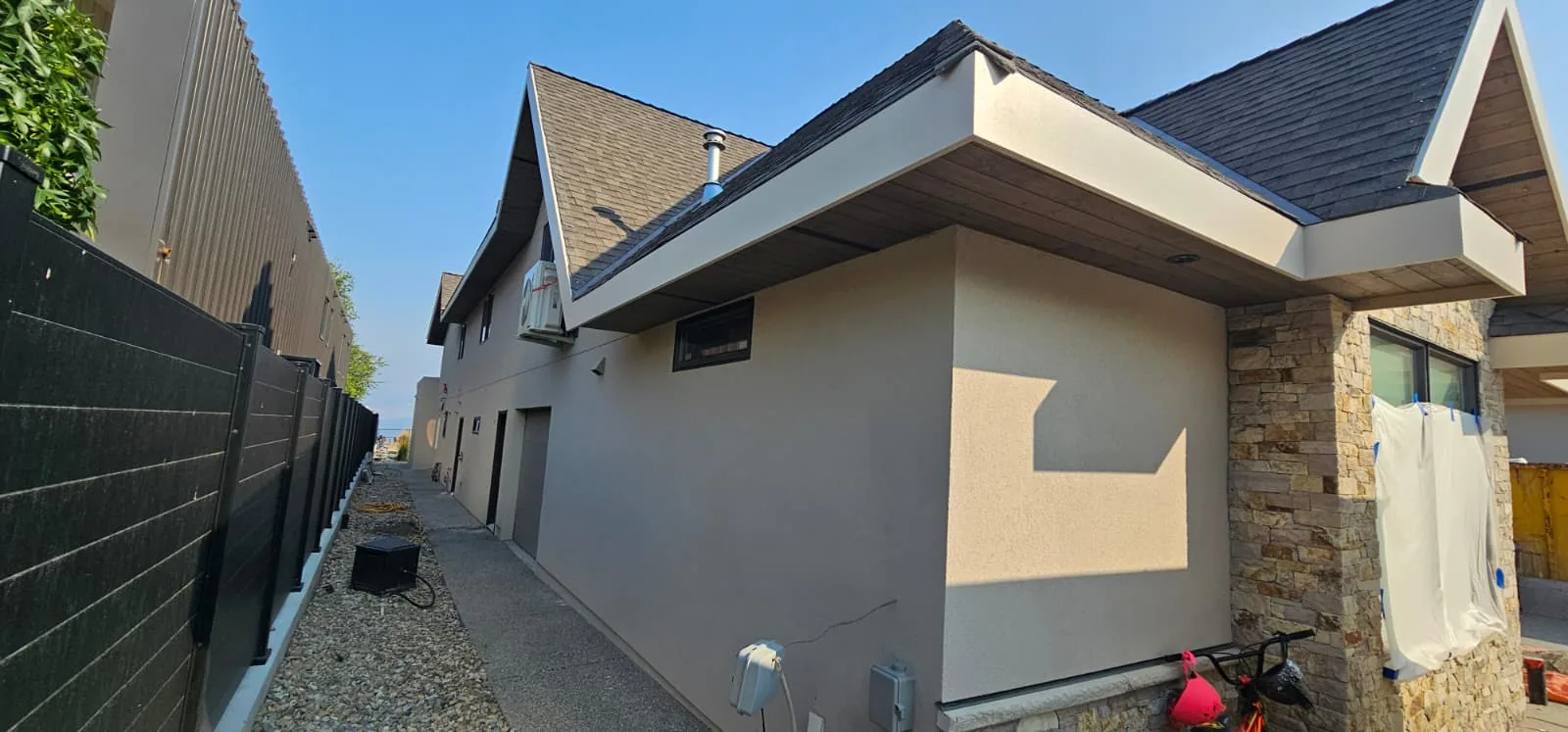 Soffit, fascia and stone corner detail on a finished elevation.