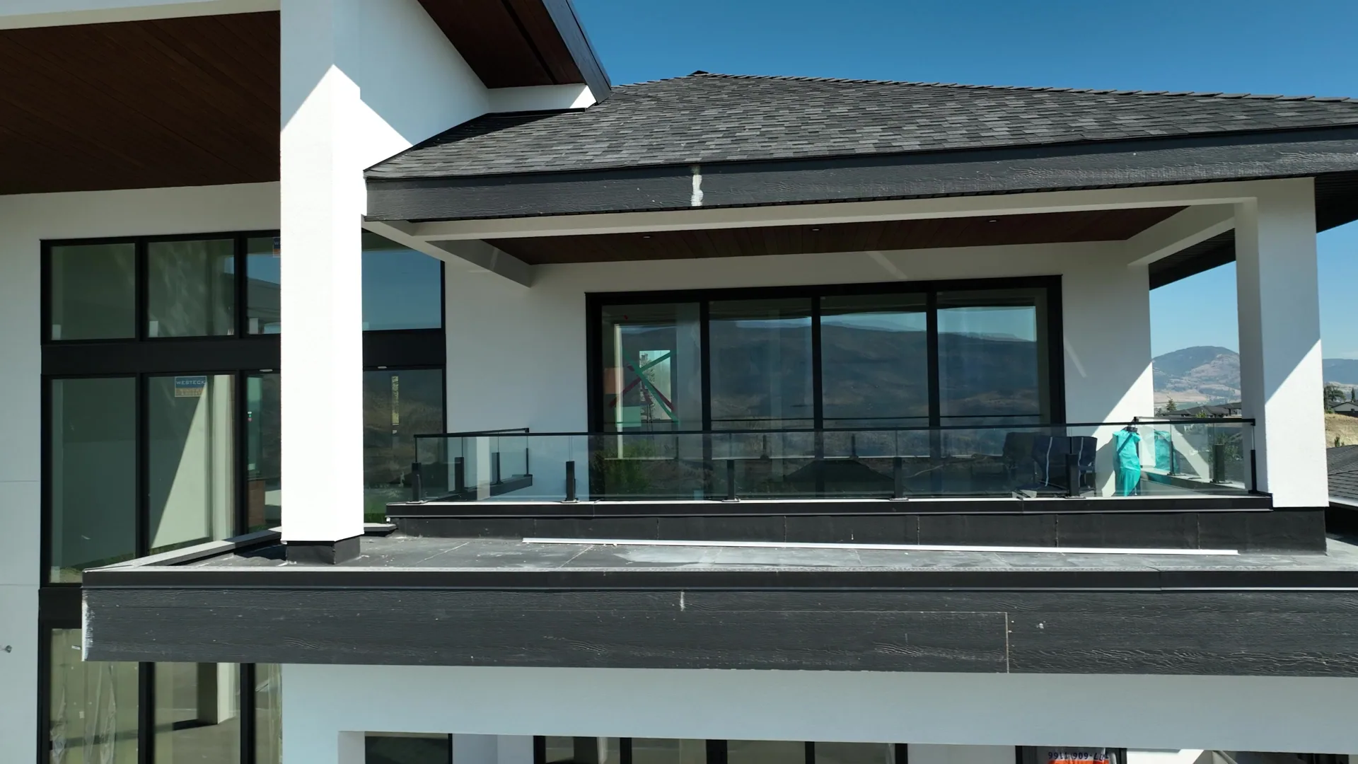 Finished soffit, fascia and column detail above a covered deck.