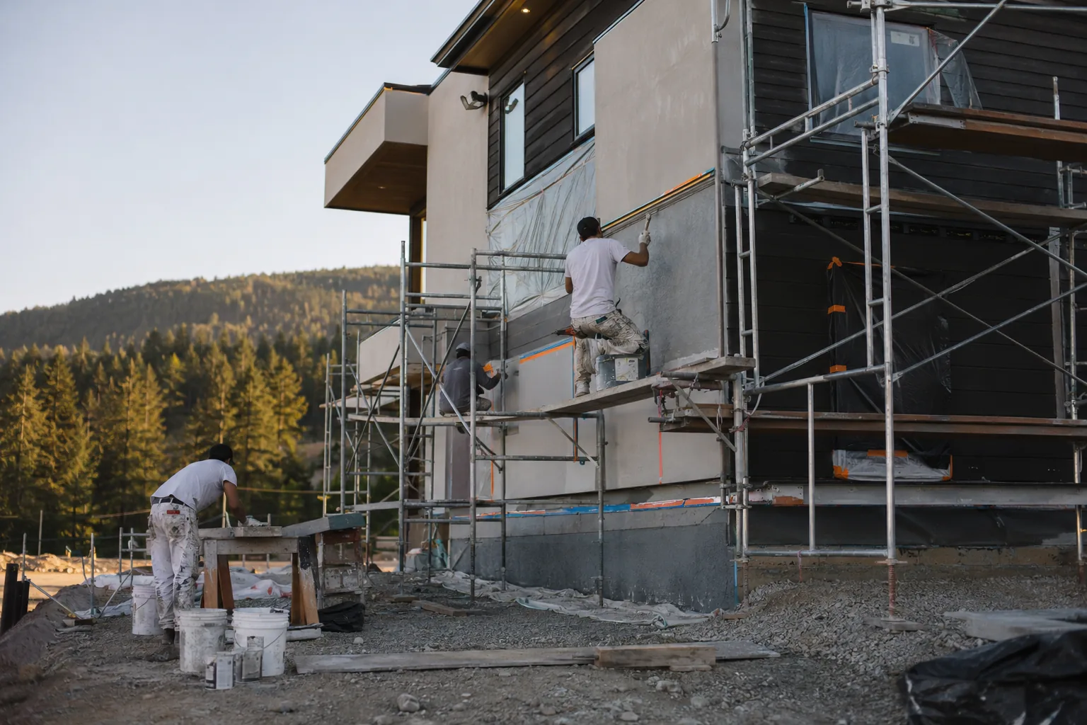The Superior Stucco crew on site, working an exterior facade together.