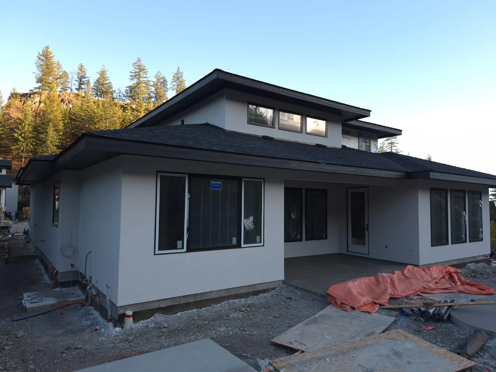 The same Lot 42 rear elevation with the finished stucco coat applied.